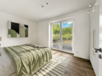 Hauptschlafzimmer - Moderne Erdgeschosswohnung mit Garten in Pötenitz – strandnah zwischen Ostsee und Travemünde