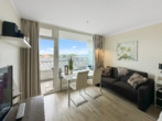 Wohn- und Essbereich - Urlaubsfeeling pur – stilvolles 1-Zimmer-Apartment am Strand von Travemünde
