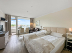 Schlaf- und Wohnbereich - Urlaubsfeeling pur – stilvolles 1-Zimmer-Apartment am Strand von Travemünde